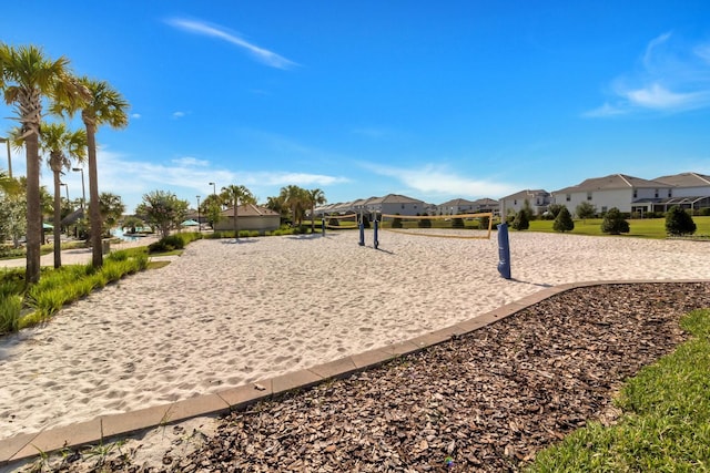 surrounding community featuring a residential view and volleyball court