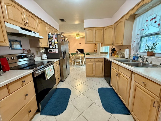 kitchen with light brown cabinetry, light tile patterned floors, sink, and appliances with stainless steel finishes