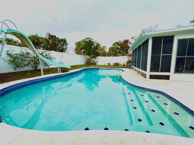 view of pool with a sunroom