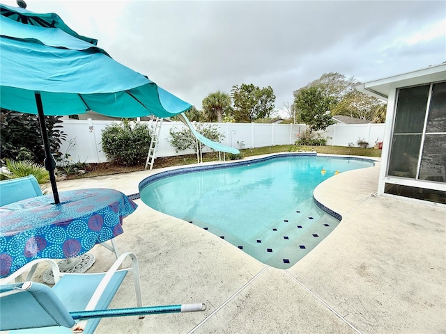 view of pool featuring a patio