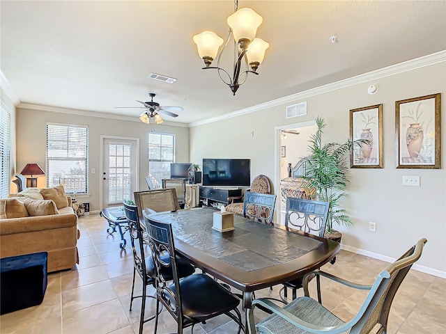 tiled dining space featuring ceiling fan with notable chandelier and ornamental molding