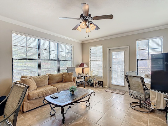 living room featuring light tile patterned floors, ceiling fan, and crown molding