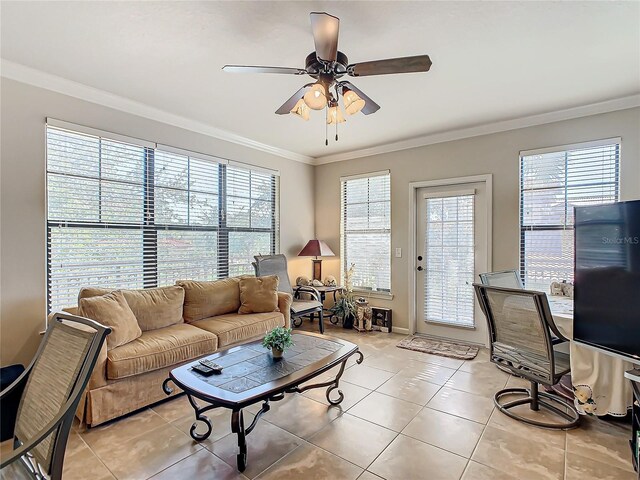 904 Charo Pkwy Unit 525, Davenport, FL 33897 - living area featuring light tile patterned floors, a ceiling fan, crown molding, and baseboards