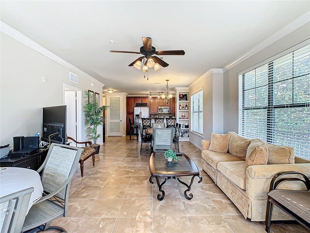 904 Charo Pkwy Unit 525, Davenport, FL 33897 - living area with crown molding, a chandelier, ceiling fan, and light tile patterned flooring