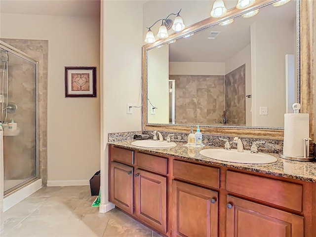 bathroom featuring tile patterned floors, vanity, and walk in shower