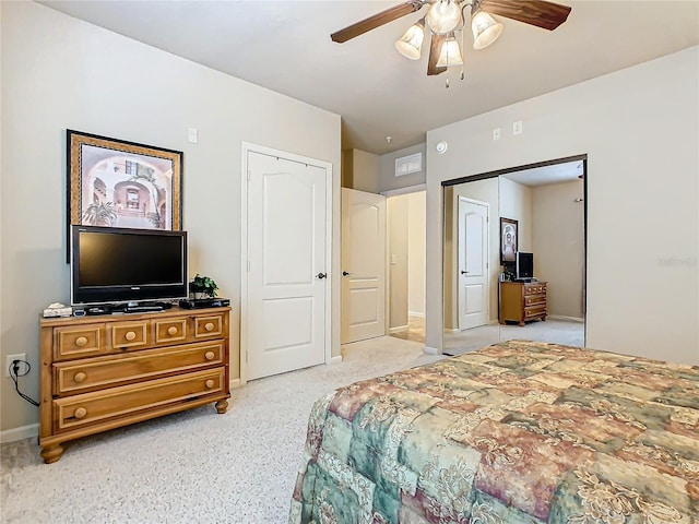 bedroom featuring ceiling fan and a closet