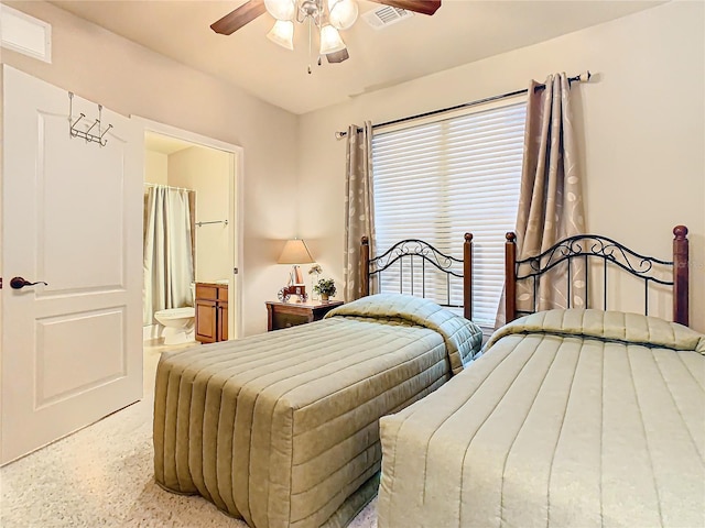 bedroom with ceiling fan and connected bathroom