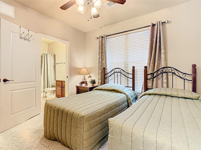 904 Charo Pkwy Unit 525, Davenport, FL 33897 - bedroom with a ceiling fan, connected bathroom, and speckled floor