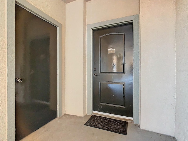 904 Charo Pkwy Unit 525, Davenport, FL 33897 - doorway to property with stucco siding