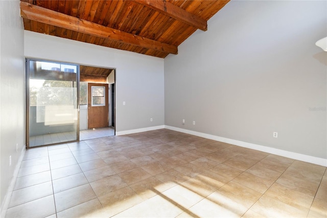 tiled empty room with vaulted ceiling with beams and wood ceiling