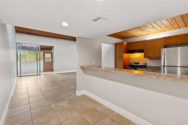 kitchen featuring appliances with stainless steel finishes, wooden ceiling, and light tile patterned flooring