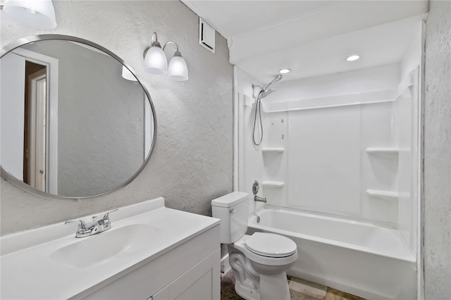 full bath with a textured wall, bathtub / shower combination, vanity, and toilet