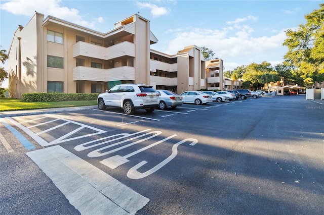 view of property featuring uncovered parking