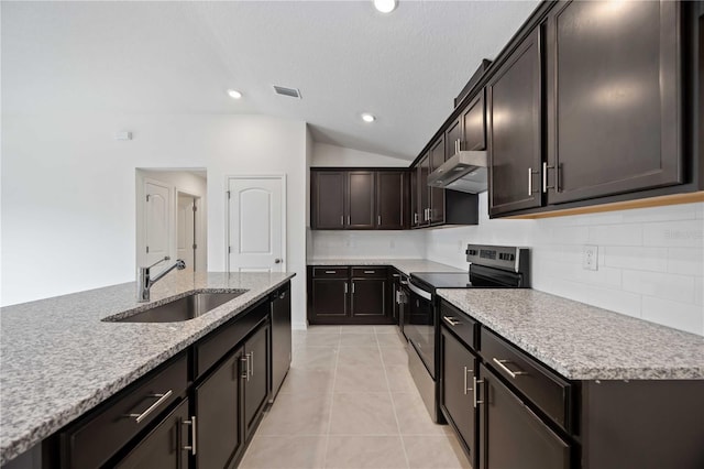 kitchen featuring lofted ceiling, sink, stainless steel appliances, light stone counters, and light tile patterned flooring