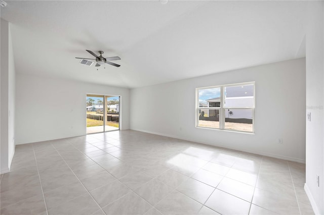 empty room with light tile patterned flooring and ceiling fan