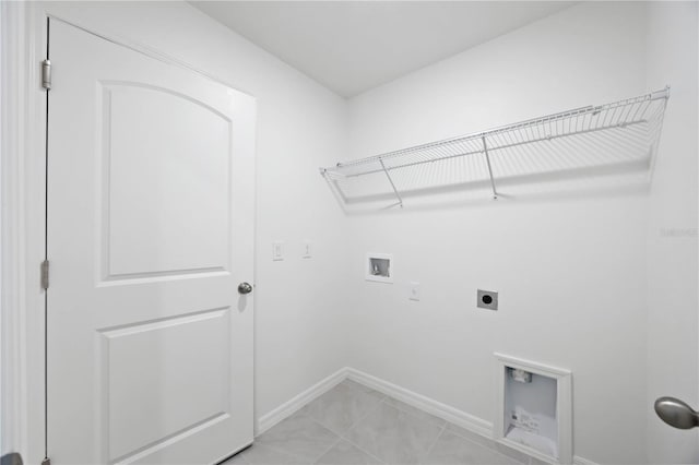 laundry area featuring washer hookup, hookup for an electric dryer, and light tile patterned floors