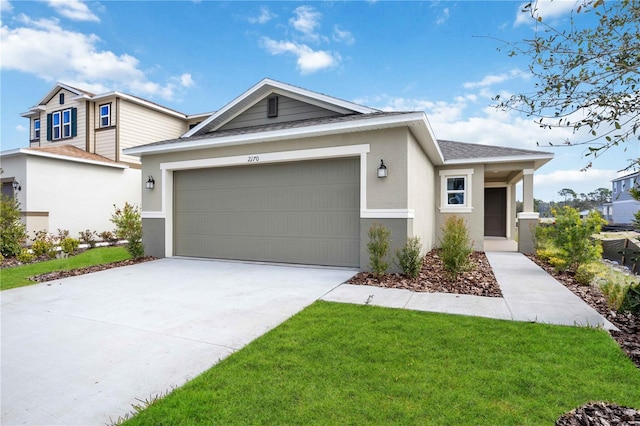 view of front of house featuring a garage and a front yard