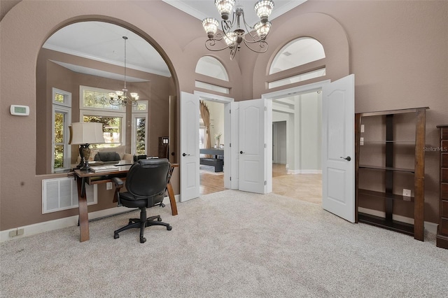 office area featuring light carpet, ornamental molding, and a notable chandelier