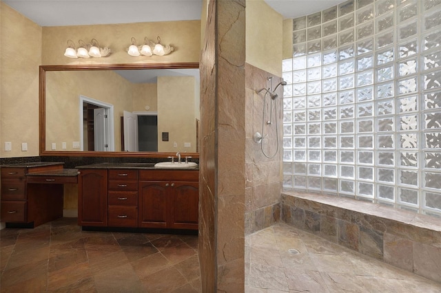 bathroom featuring vanity and a shower