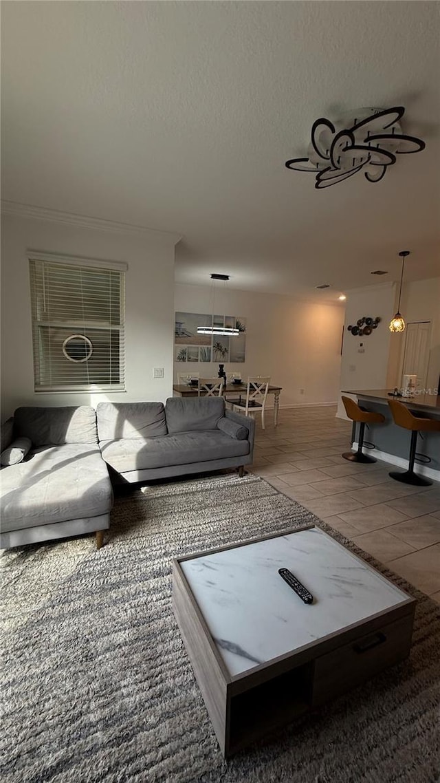 living room featuring tile patterned floors and a textured ceiling