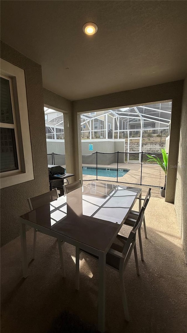 view of patio / terrace with glass enclosure