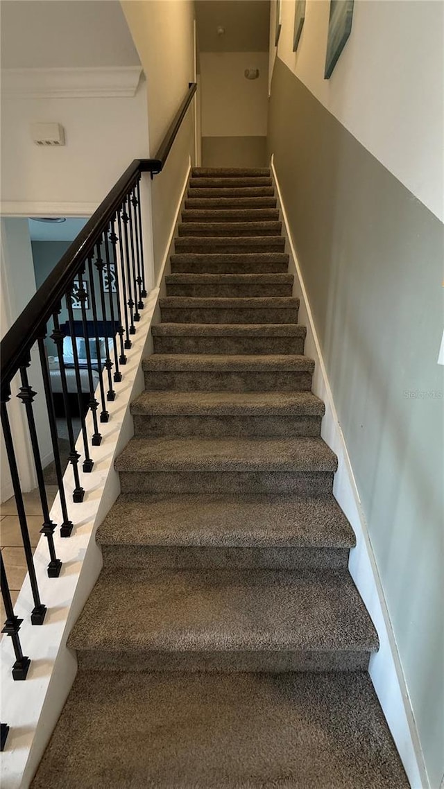 staircase with crown molding