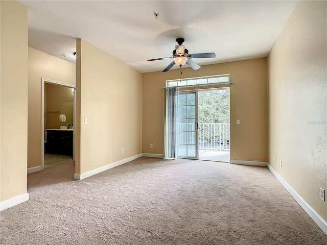 carpeted empty room with ceiling fan