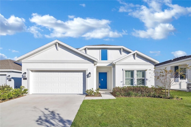 view of front of house featuring a garage and a front lawn