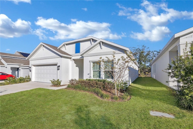 view of front of property with a front yard and a garage