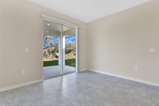 spare room with light tile patterned flooring