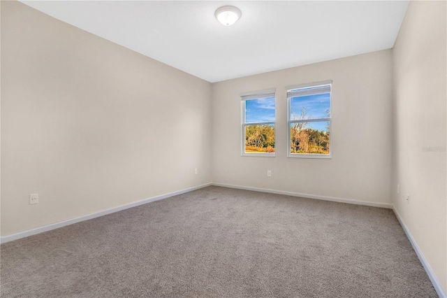 unfurnished room with carpet floors