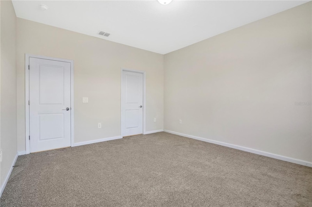 empty room featuring carpet flooring