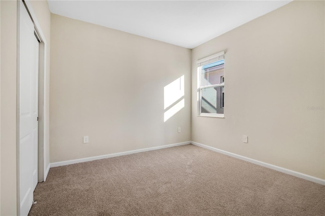 unfurnished bedroom with carpet flooring and a closet