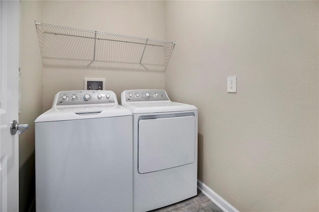 washroom featuring washer and dryer