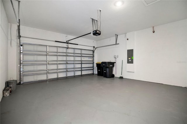 garage with electric panel and a garage door opener