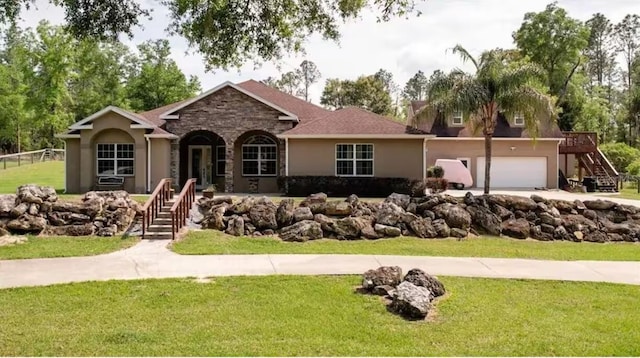 single story home with a front yard