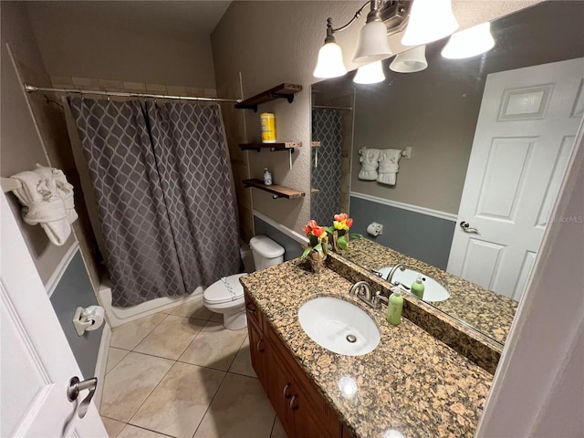 full bathroom featuring tile patterned flooring, shower / tub combo, vanity, and toilet