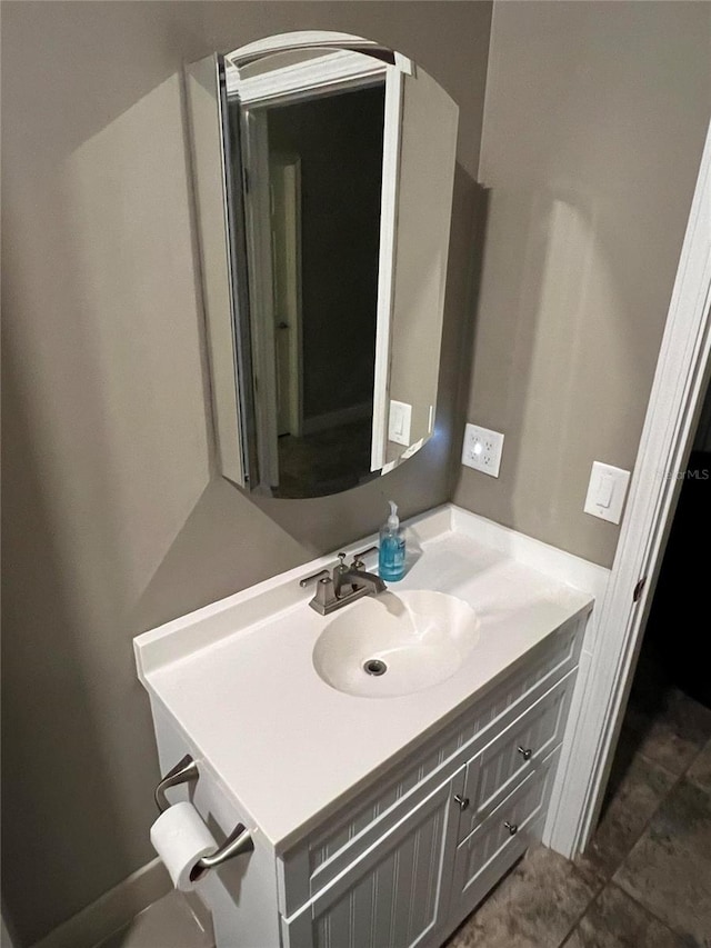 bathroom with tile patterned floors and vanity