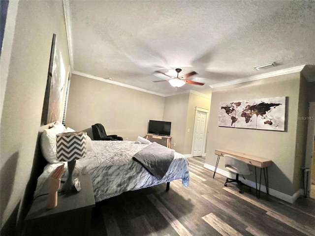 bedroom with ceiling fan, crown molding, wood-type flooring, and a textured ceiling