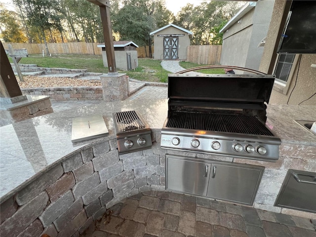 view of patio featuring area for grilling and a grill