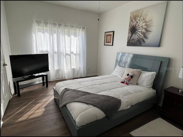 bedroom featuring dark hardwood / wood-style floors