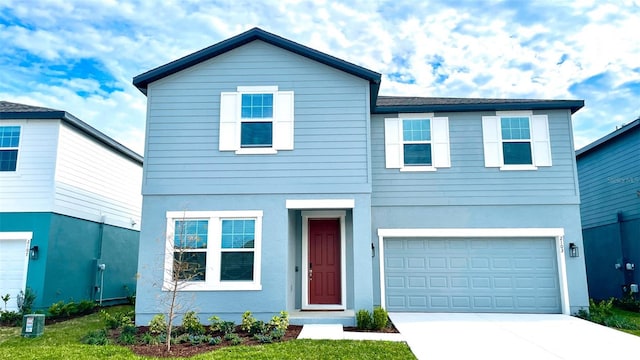 front of property featuring a garage and a front yard