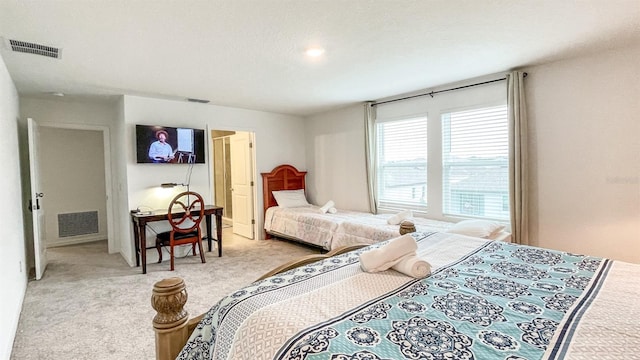 bedroom featuring light colored carpet