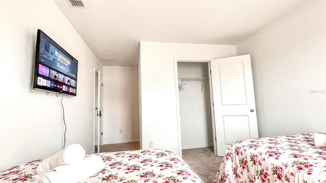 bedroom featuring carpet and a closet