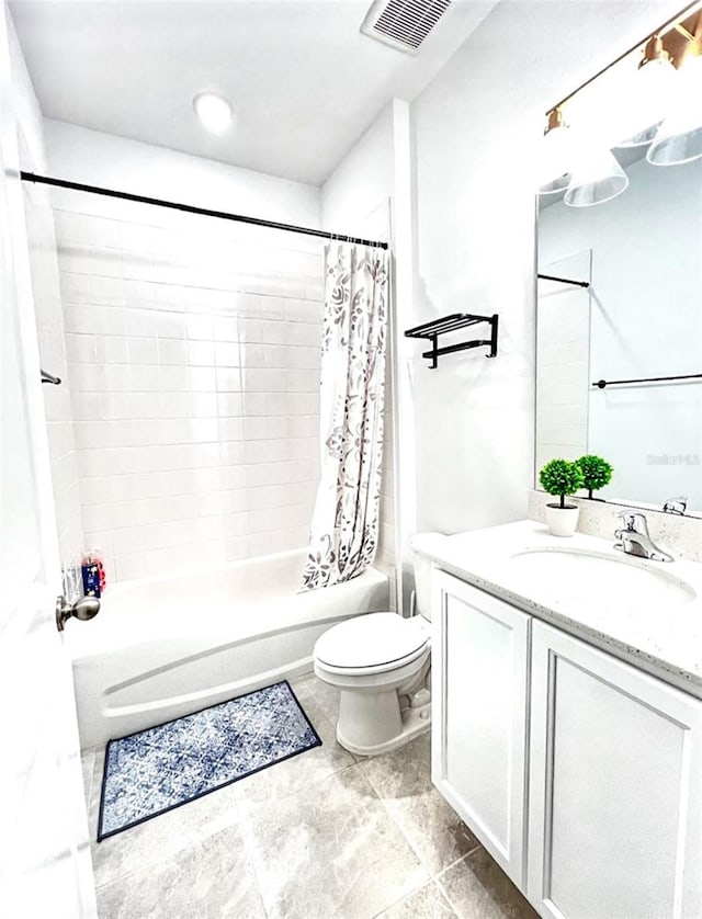 full bathroom featuring vanity, shower / bath combination with curtain, and toilet