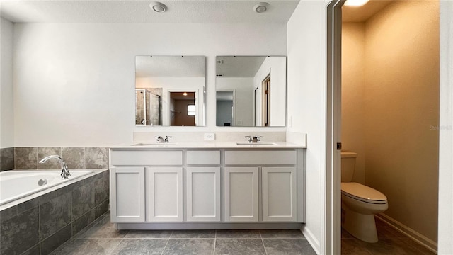 full bathroom with tile patterned floors, plus walk in shower, vanity, and toilet