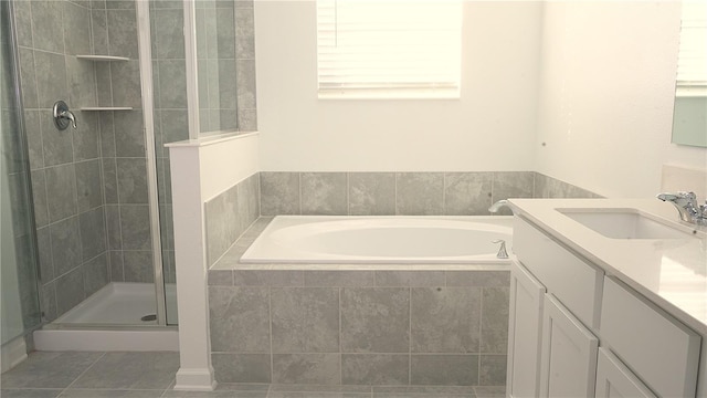 bathroom with tile patterned flooring, vanity, and separate shower and tub