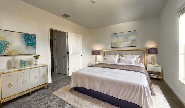 carpeted bedroom with vaulted ceiling