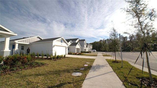 exterior space with a yard and a garage