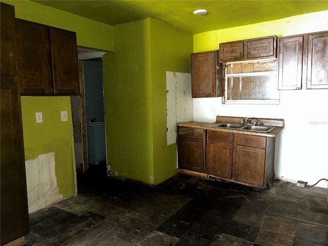 kitchen featuring sink and dark brown cabinetry